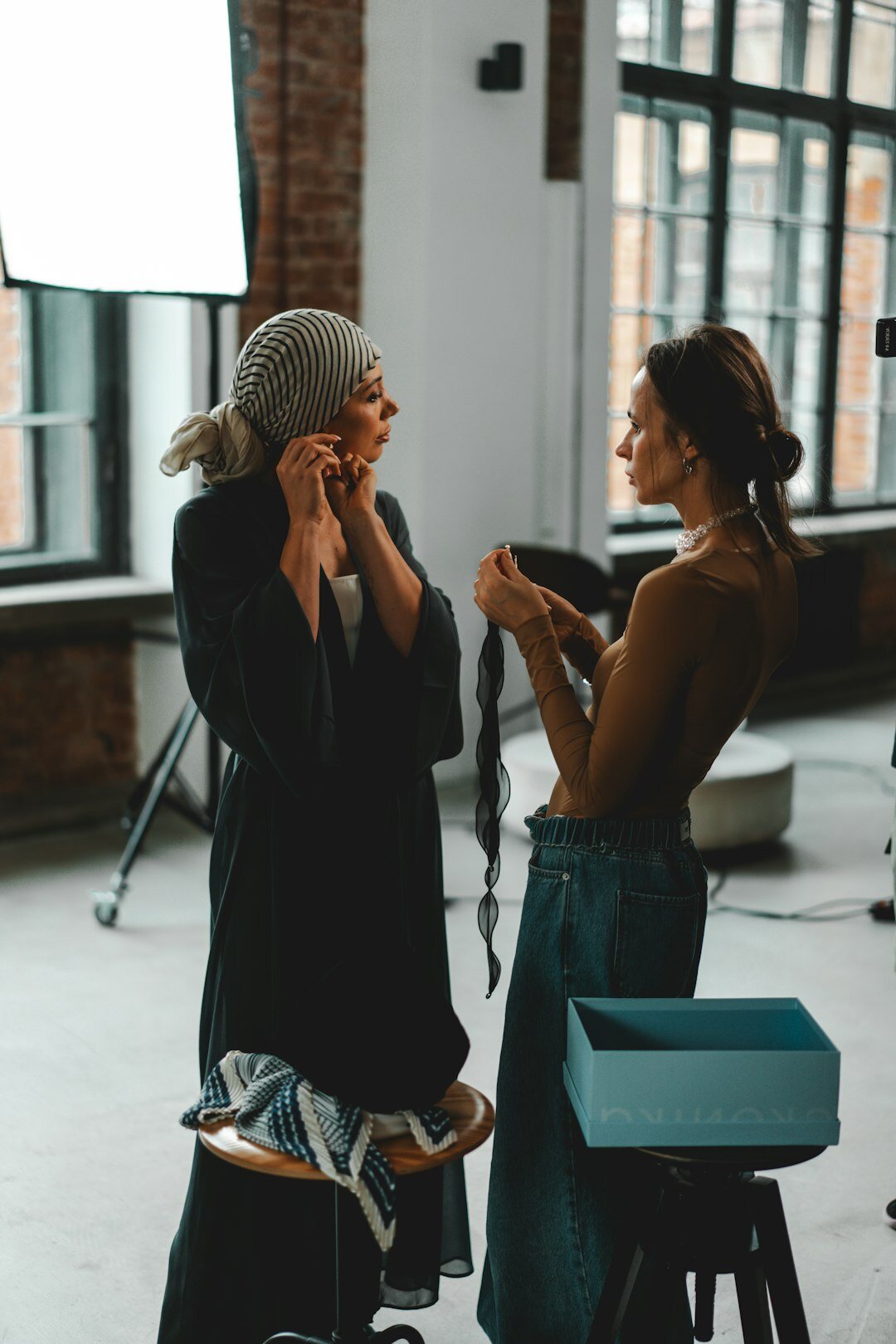 Backstage candid moment with makeup artist and actress before a gala