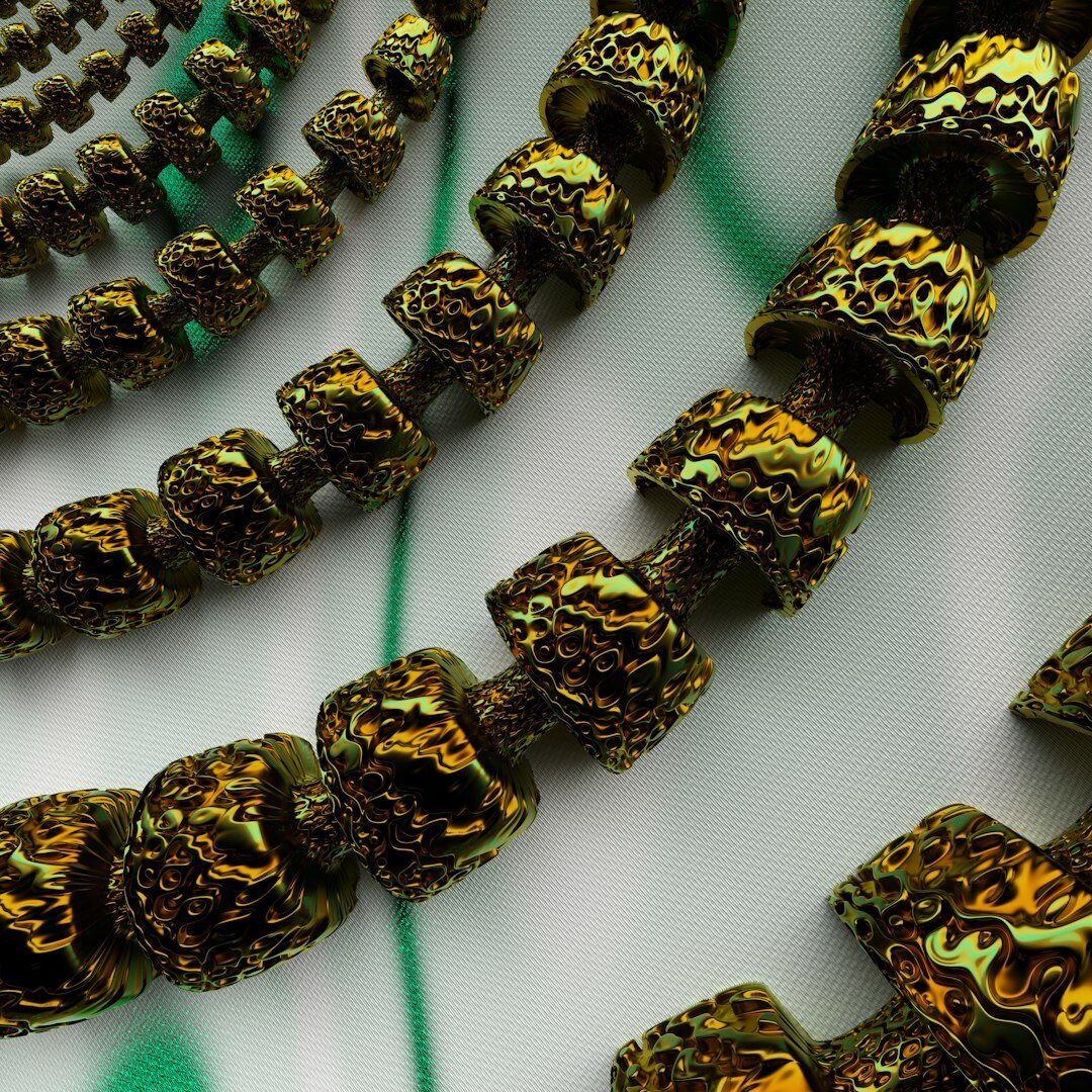 Close-up detail of vintage gold jewelry and silk fabric