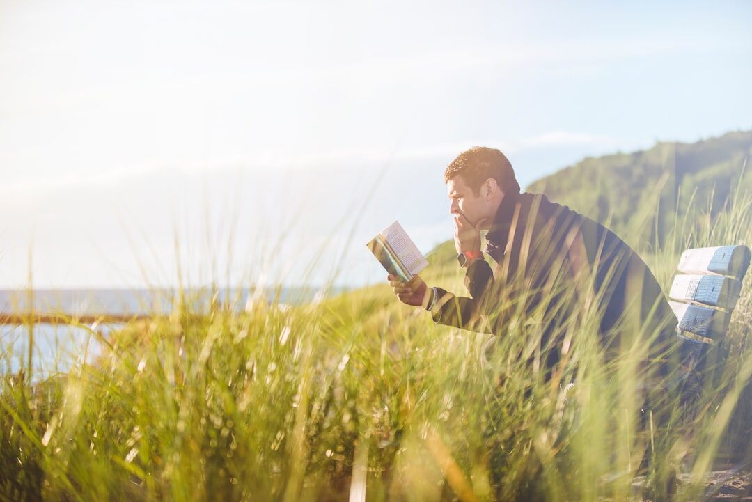 person reading inspirational book