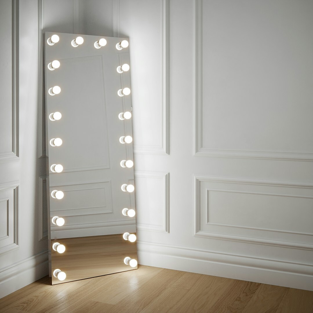 Dressing room mirror with lightbulbs and costume details
