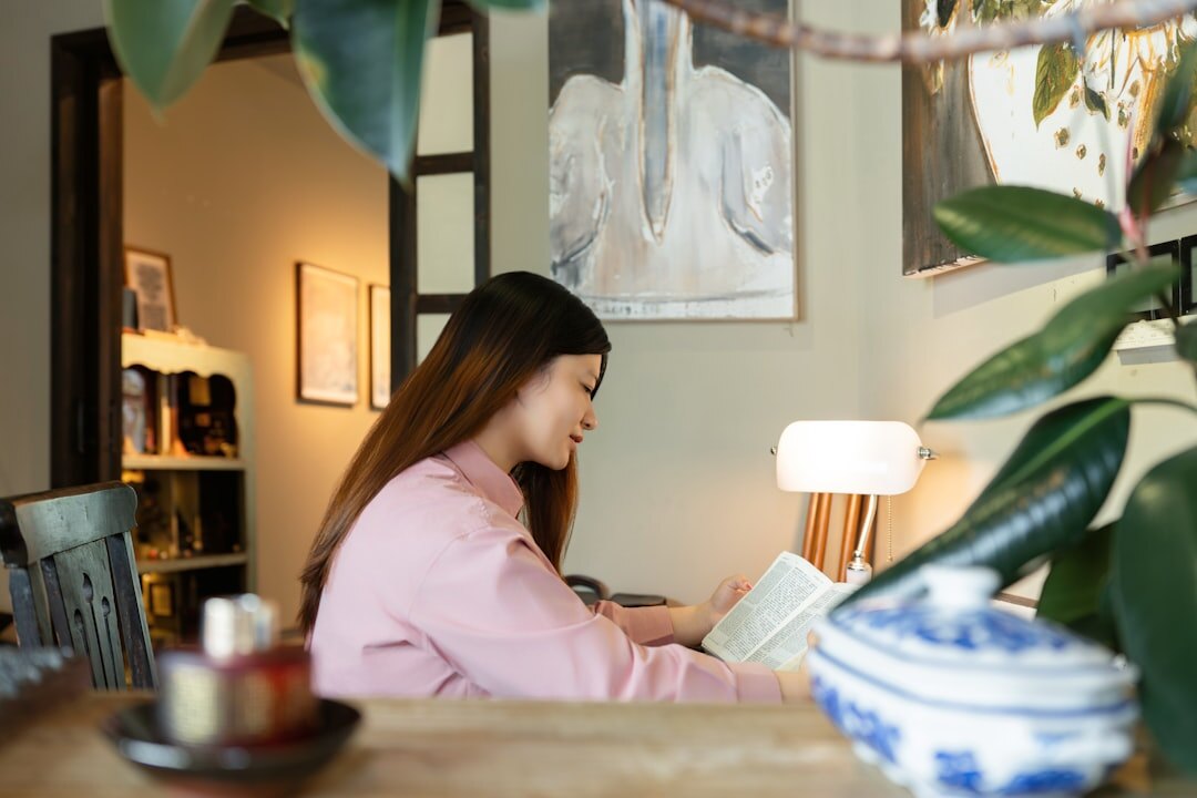 Editor reviewing printed magazine spreads at a desk
